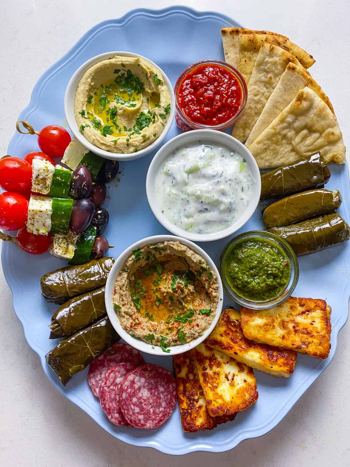 Fill up the mezze board with larger mezze, such as stuffed grape leaves and cheeses.