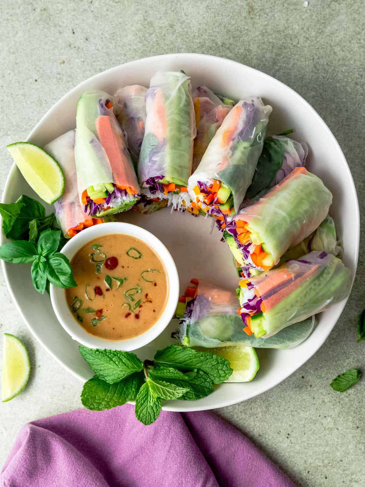 Fresh summer rolls with avocado and served with a peanut sauce for dipping.