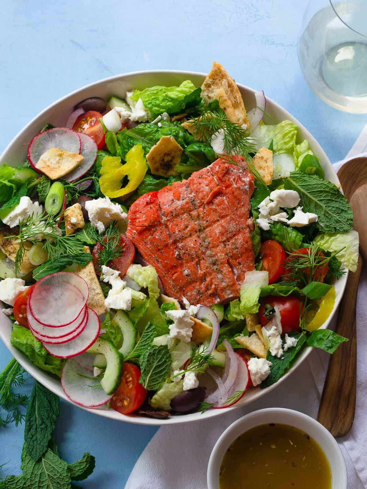 Easy Greek salad with salmon recipe and red wine dressing.