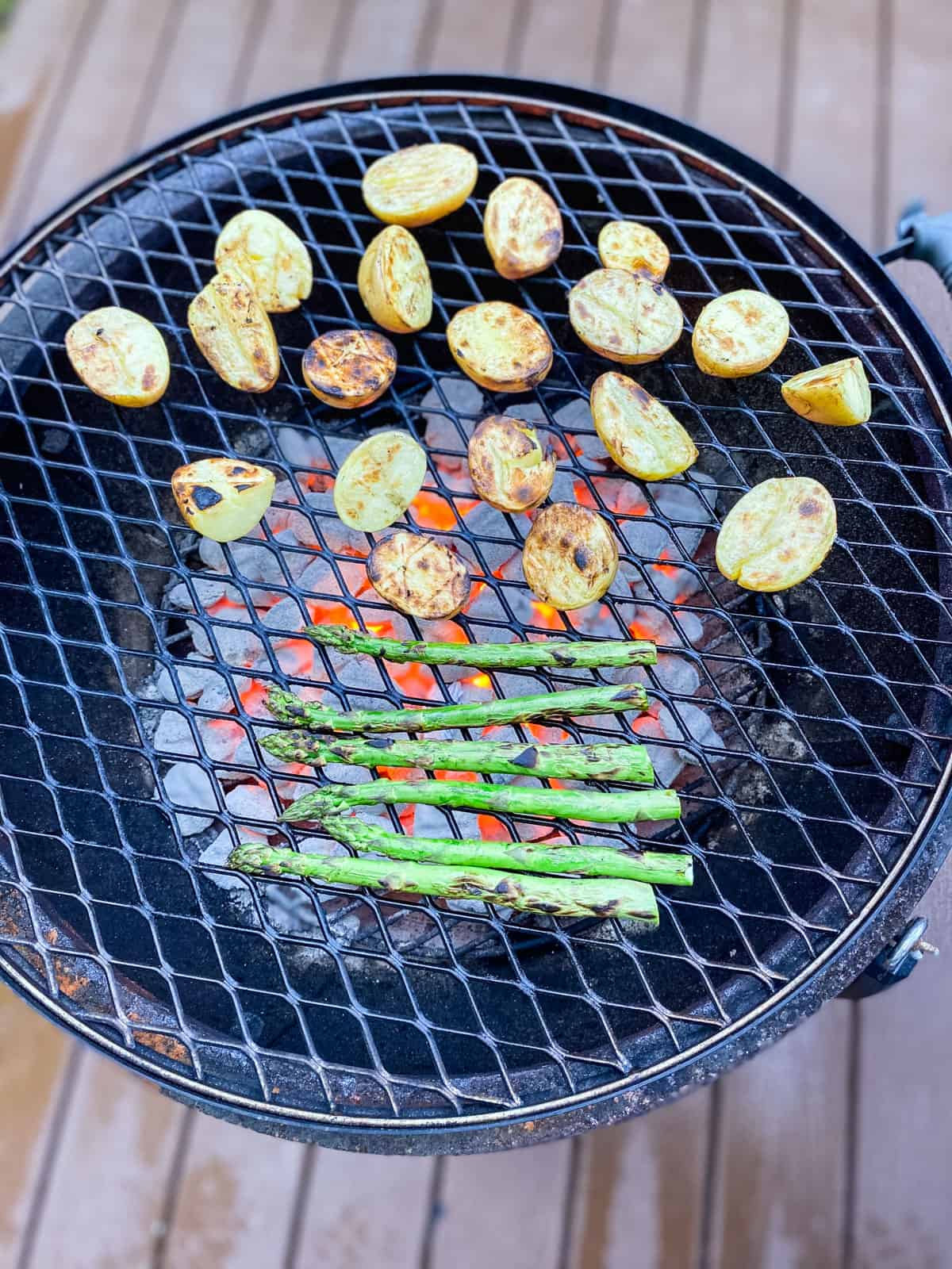 Grill the potatoes and asparagus until lightly charred on all sides.