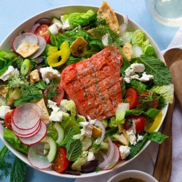 Healthy Greek salmon salad with fresh dill and mint.