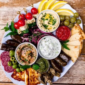 Mediterranean charcuterie board with tzatziki, hummus and more.