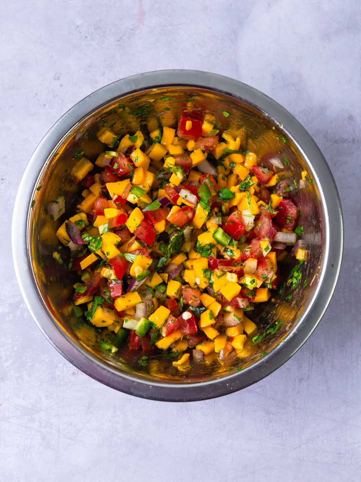 Mix all of the mango pico de gallo ingredients together in a bowl.