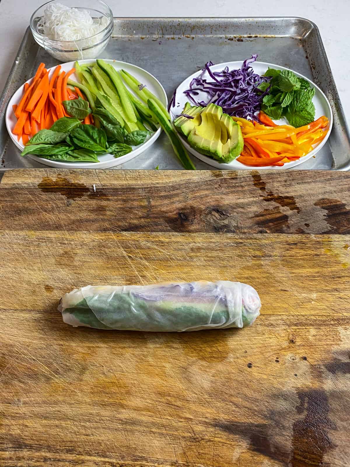 Continue rolling up the rice paper roll so all of the vegetables are tightly rolled in.