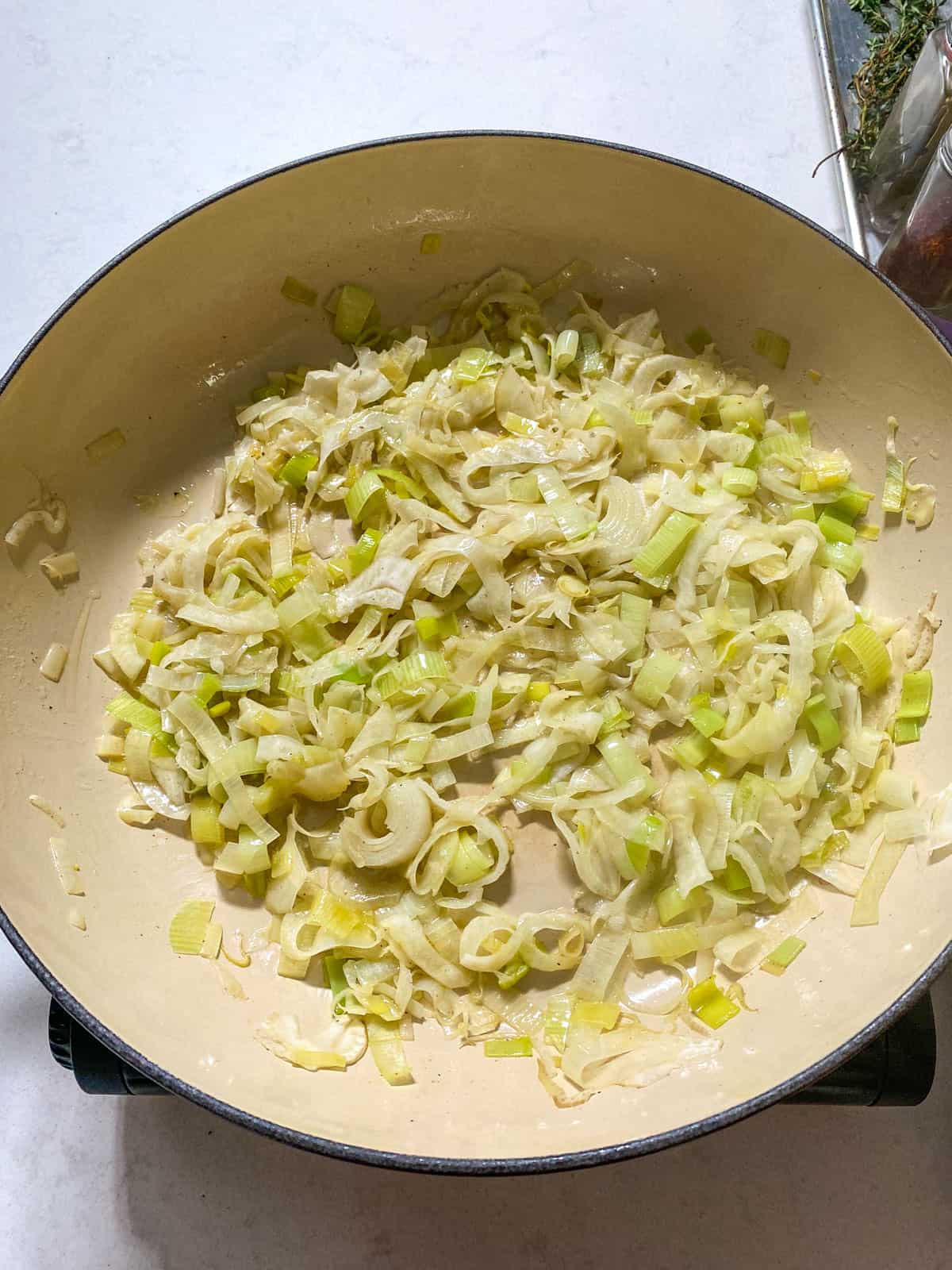 Saute the sliced fennel and leeks until softened.