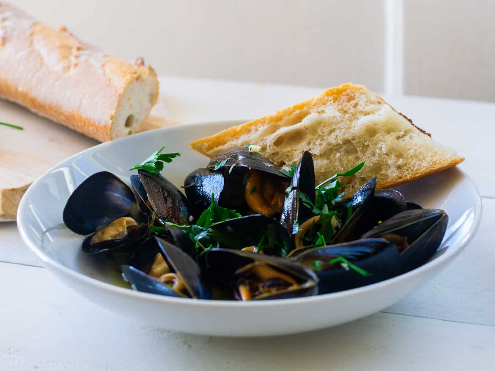 French mussels mariniere recipe served with bread for dipping.