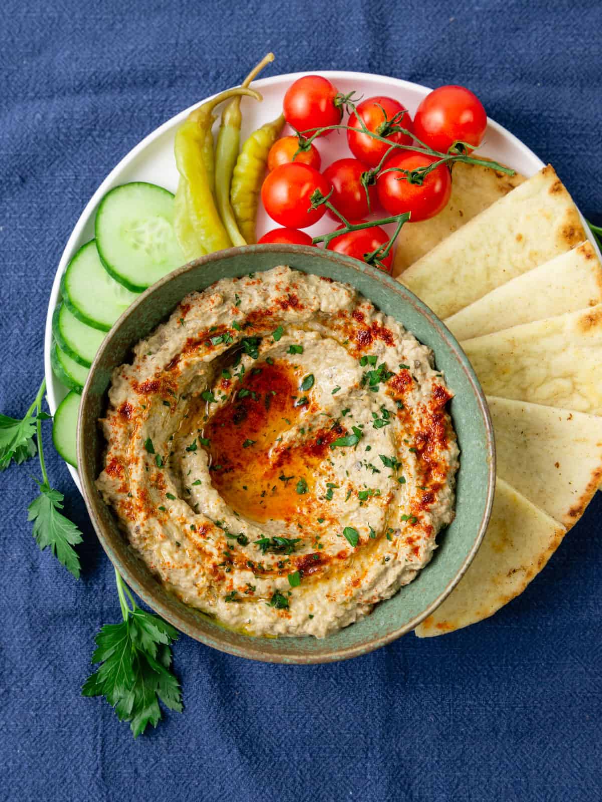 Lebanese baba ganoush recipe served with pita bread and vegetables.