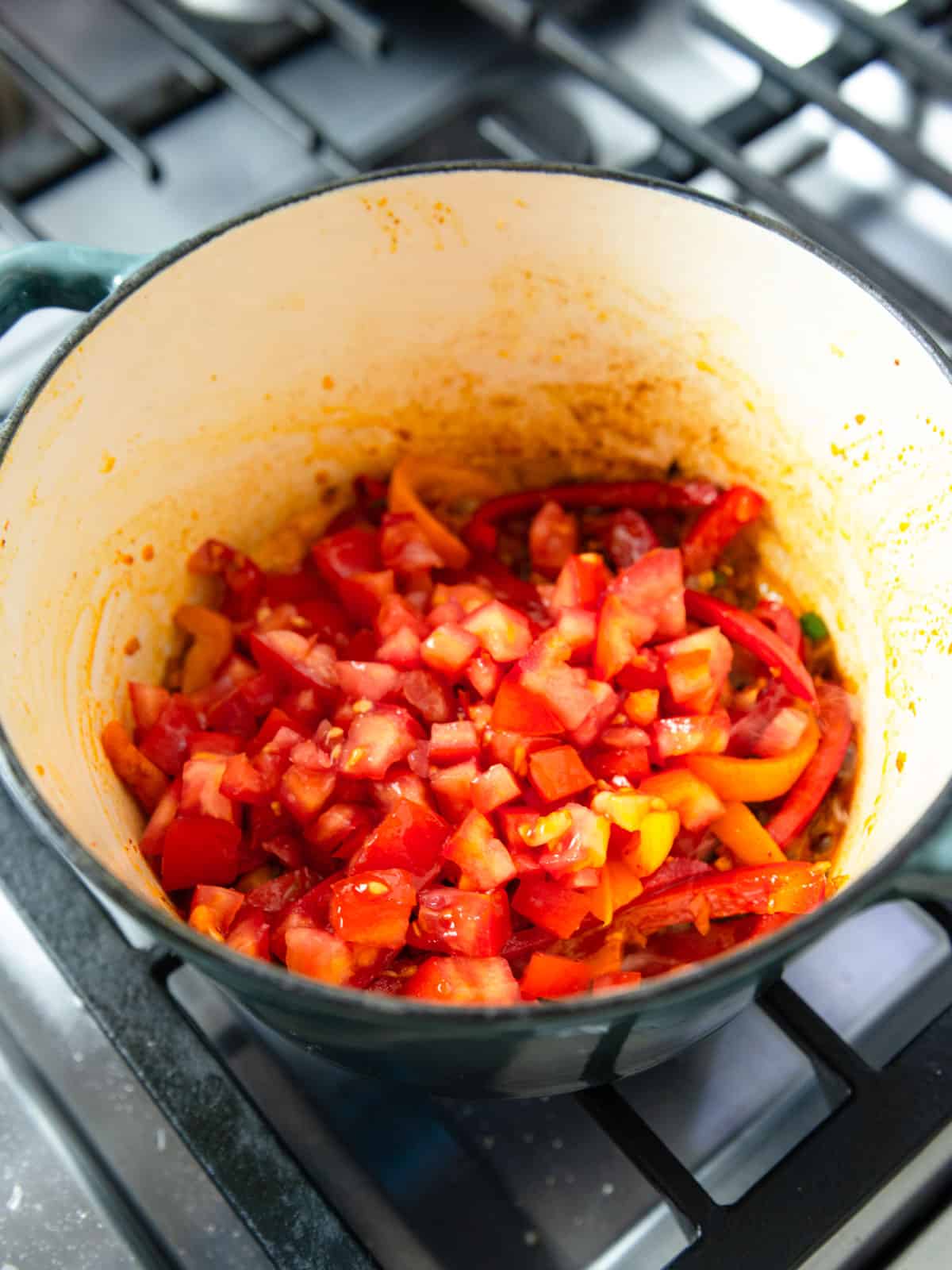 Add the chopped tomatoes to the pot, with their juices.