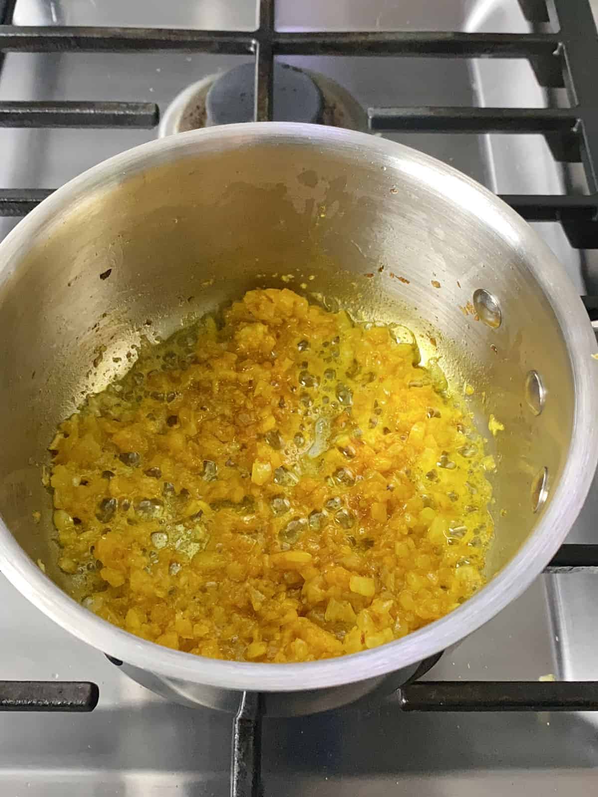 Saute ground turmeric with the chopped onions and olive oil.