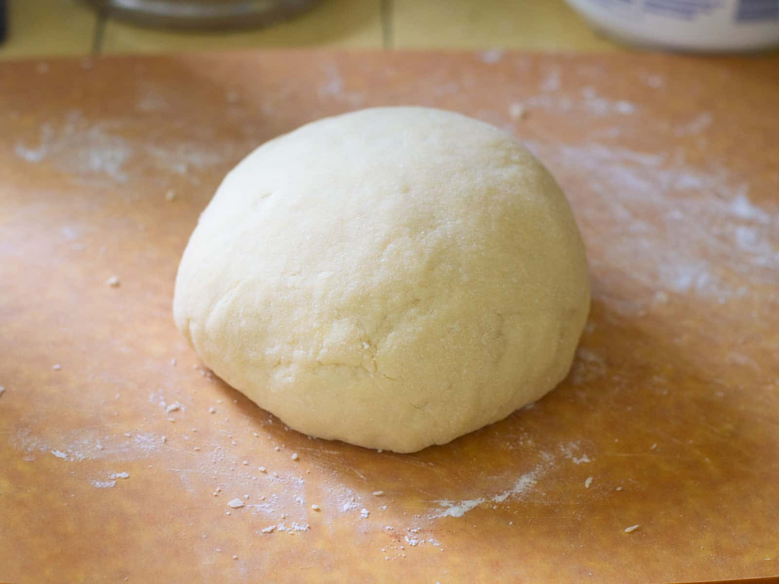 Make the empanada dough and knead until smooth.