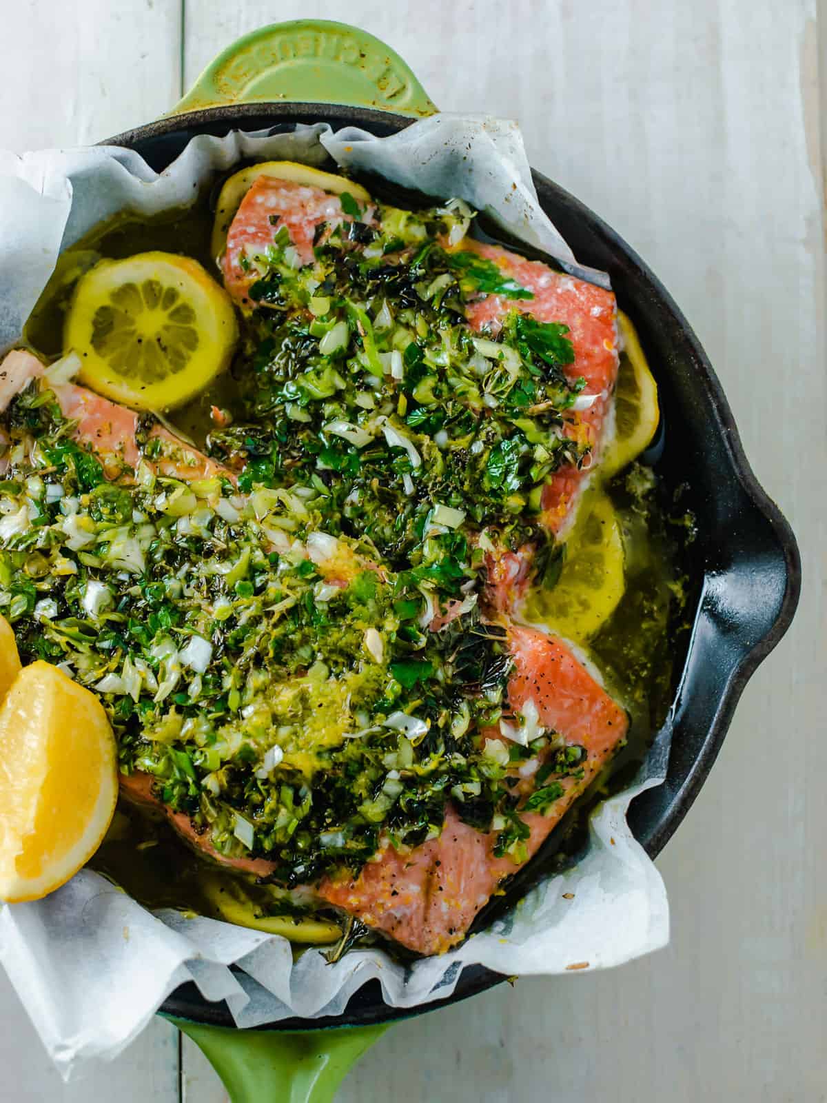 Lemon and herb crusted salmon with olive oil.