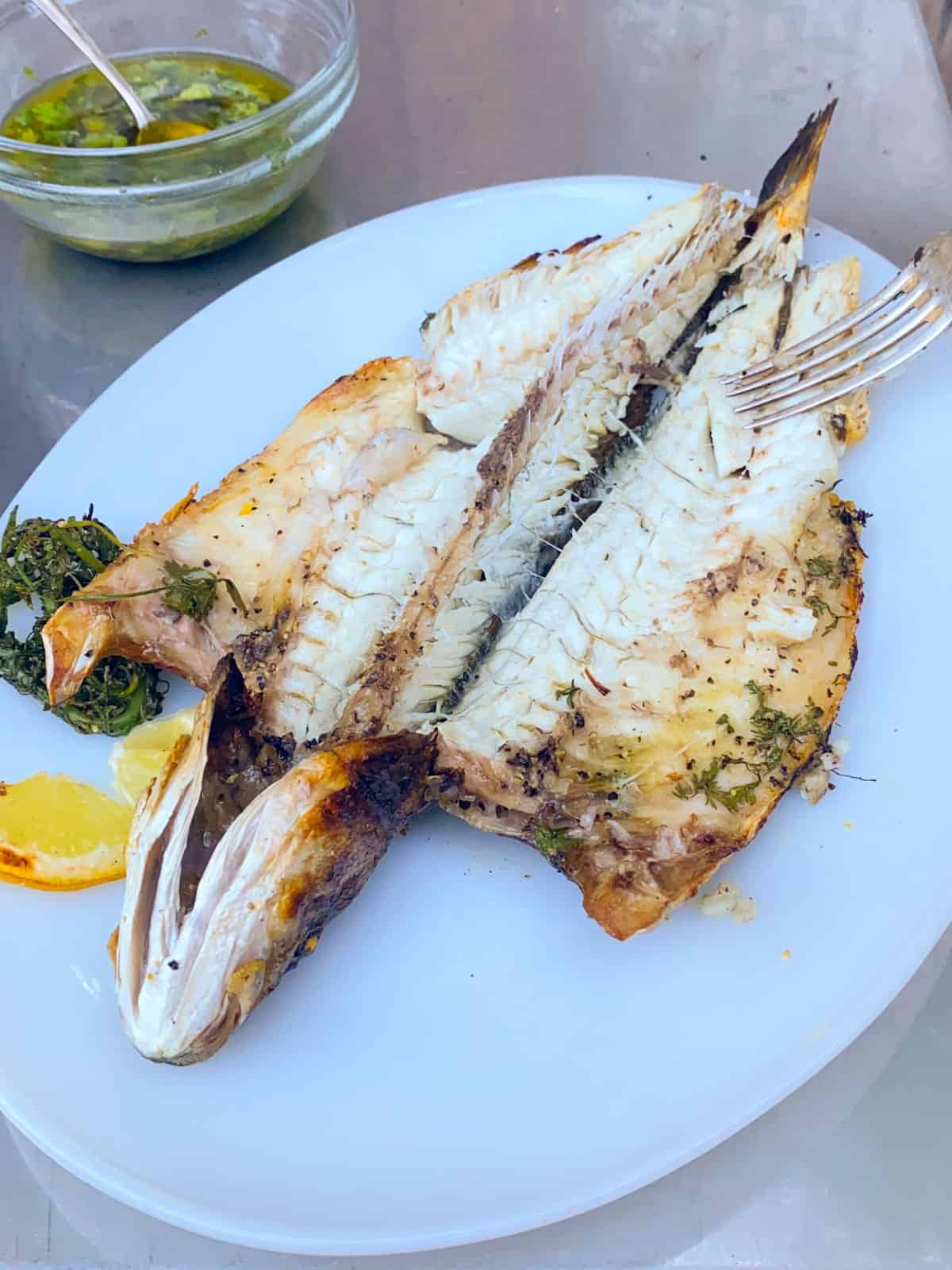 Open up the grilled branzino.
