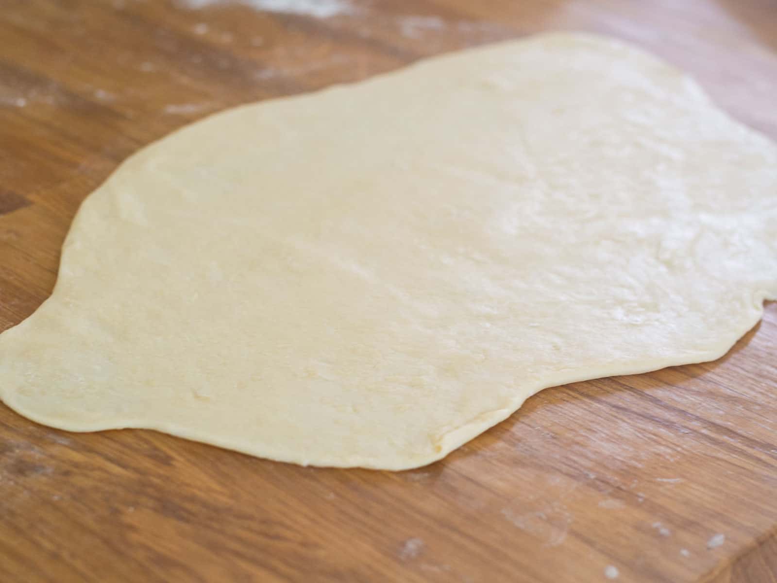 Roll the empanada dough to a ¼ inch in thickness.