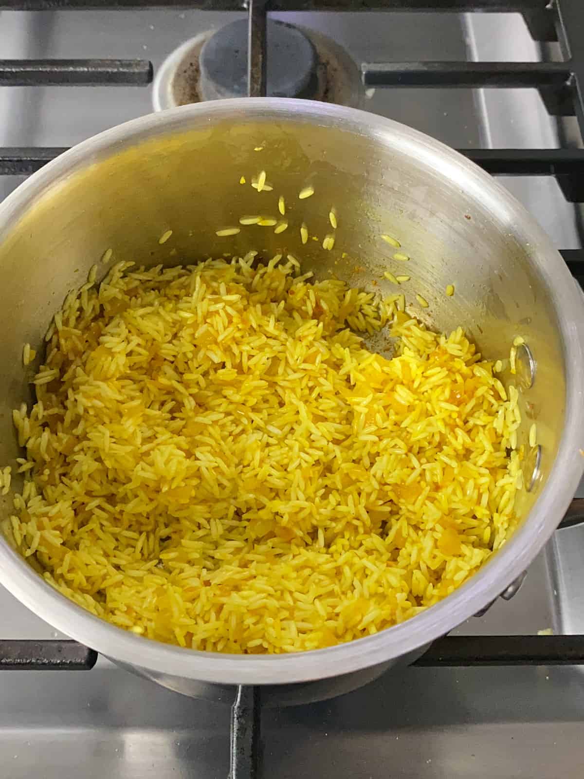 Saute the basmati rice in the infused olive oil until all of the grains are lightly toasted.