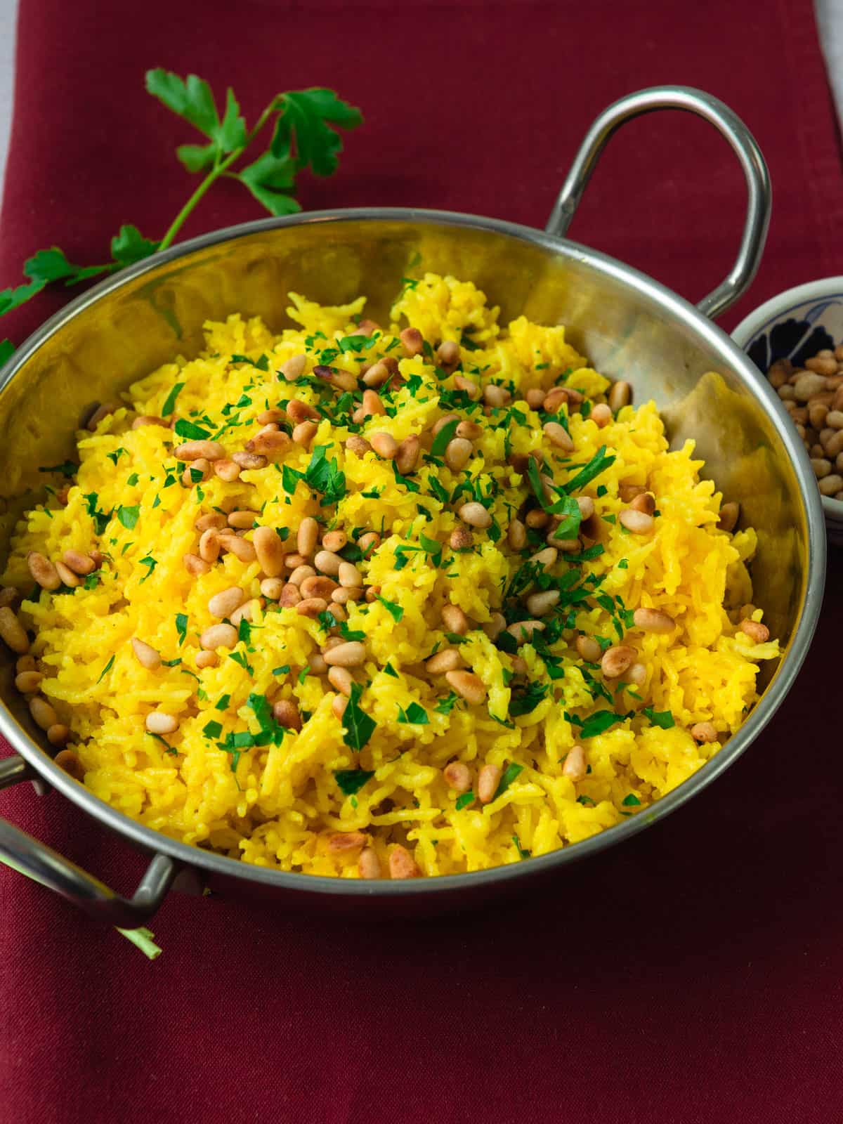 Turmeric Mediterranean rice with toasted pine nuts.