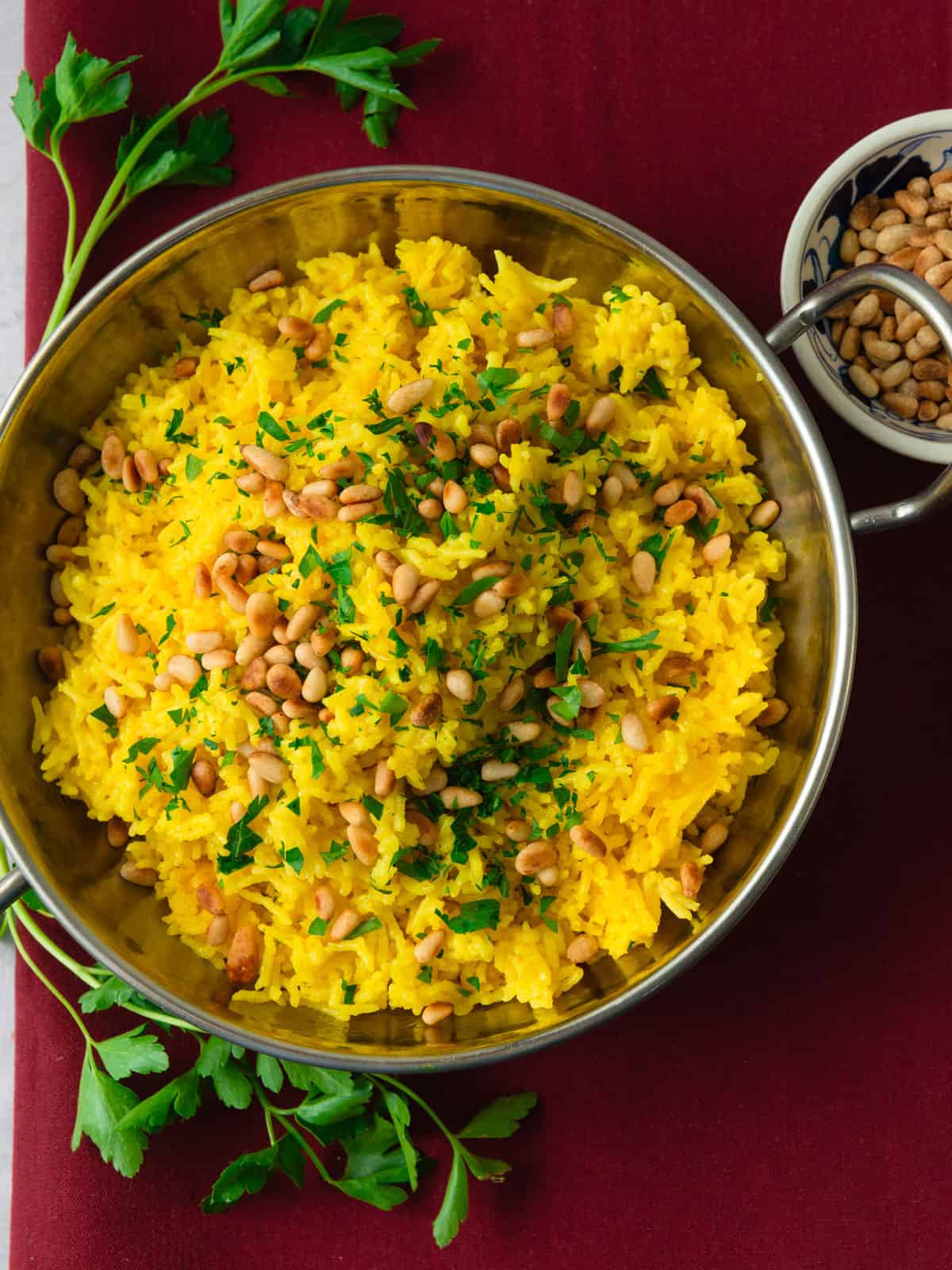 Yellow Mediterranean rice with toasted pine nuts.