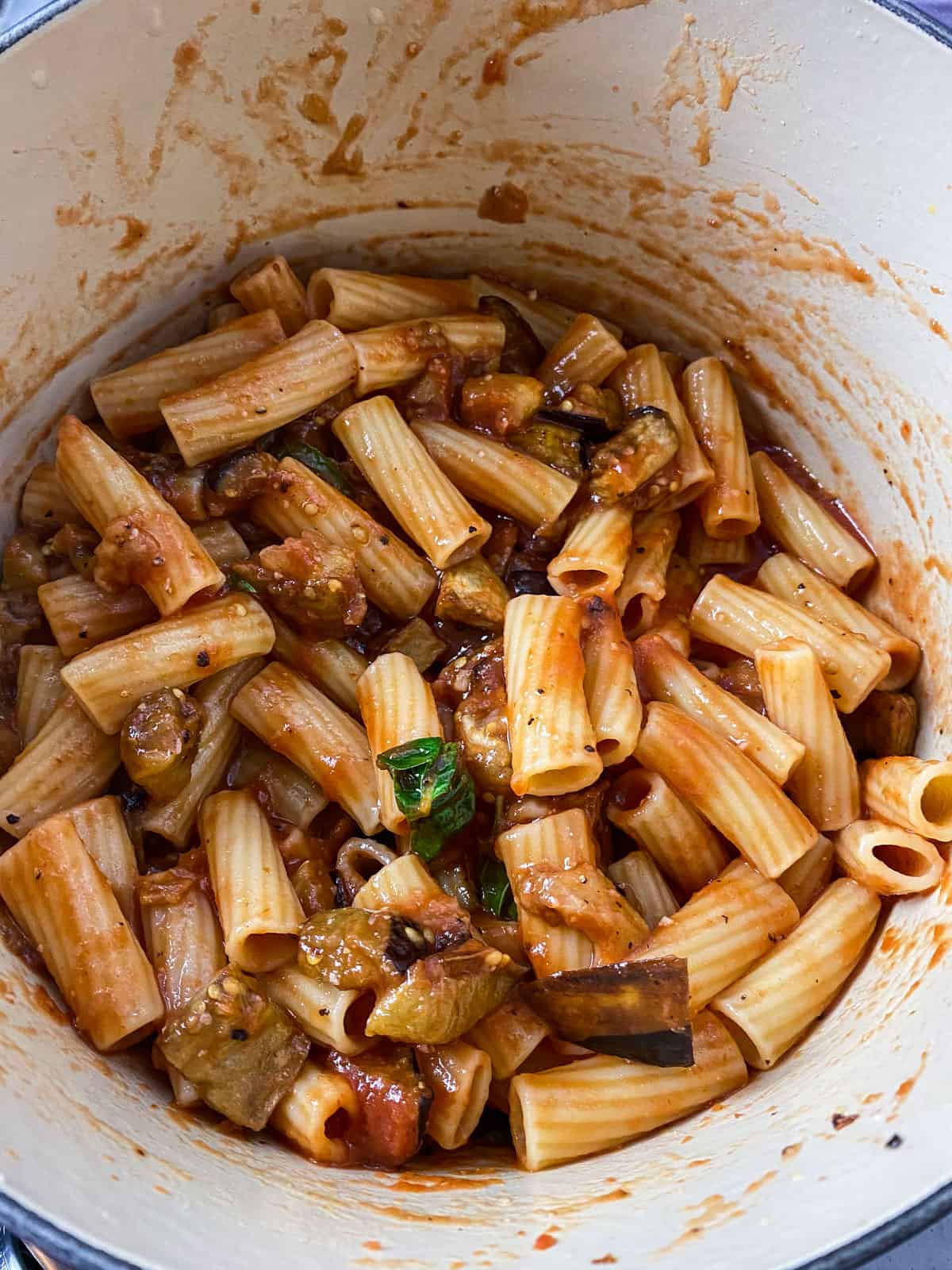 Mix the eggplant pasta together so all of the rigatoni noodles are evenly coated with the tomato sauce.