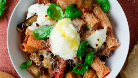 Rigatoni alla norma with creamy ricotta cheese and finished with fresh basil and Parmesan.