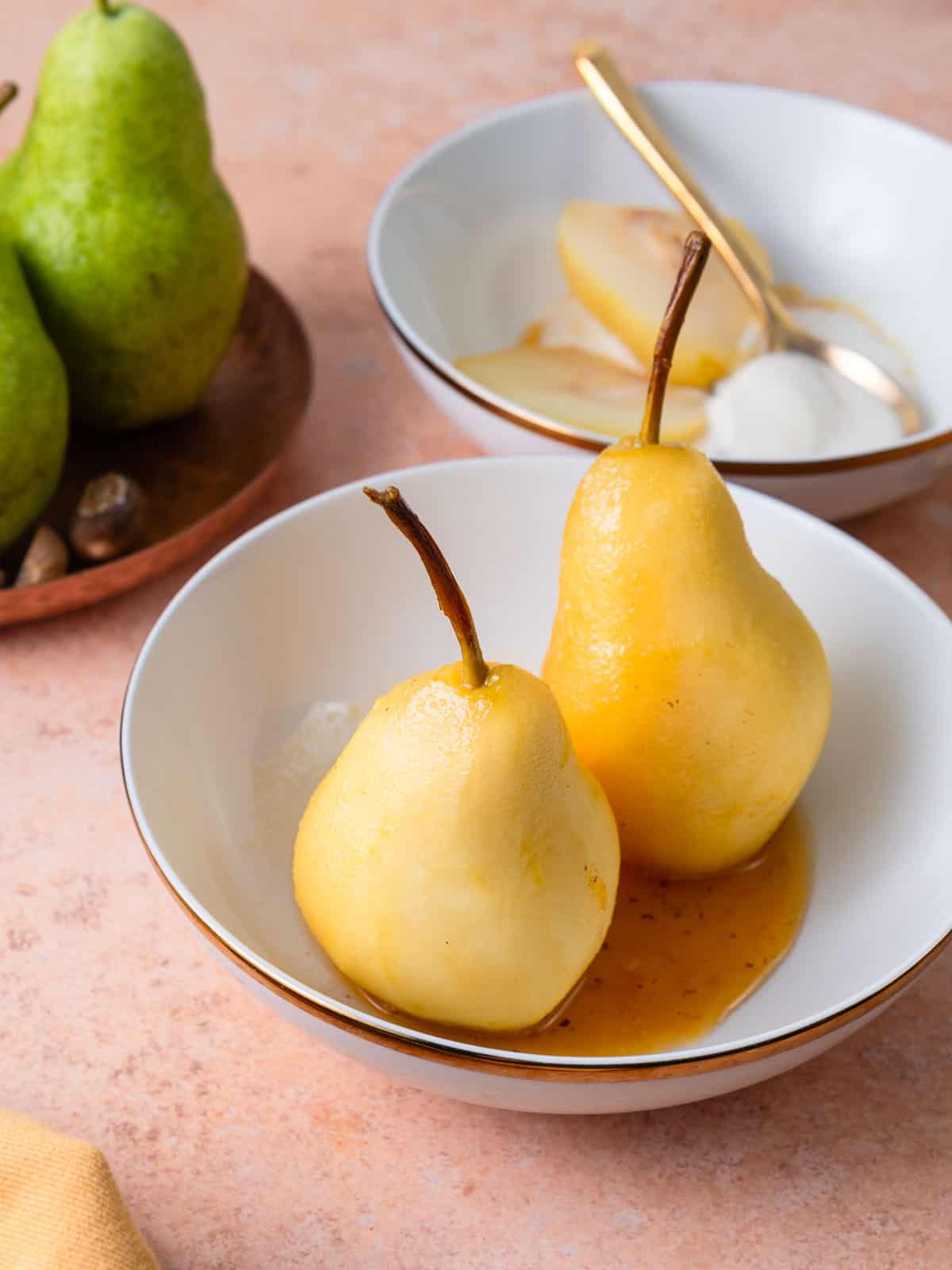 White wine poached pears served whole with reduced wine sauce.
