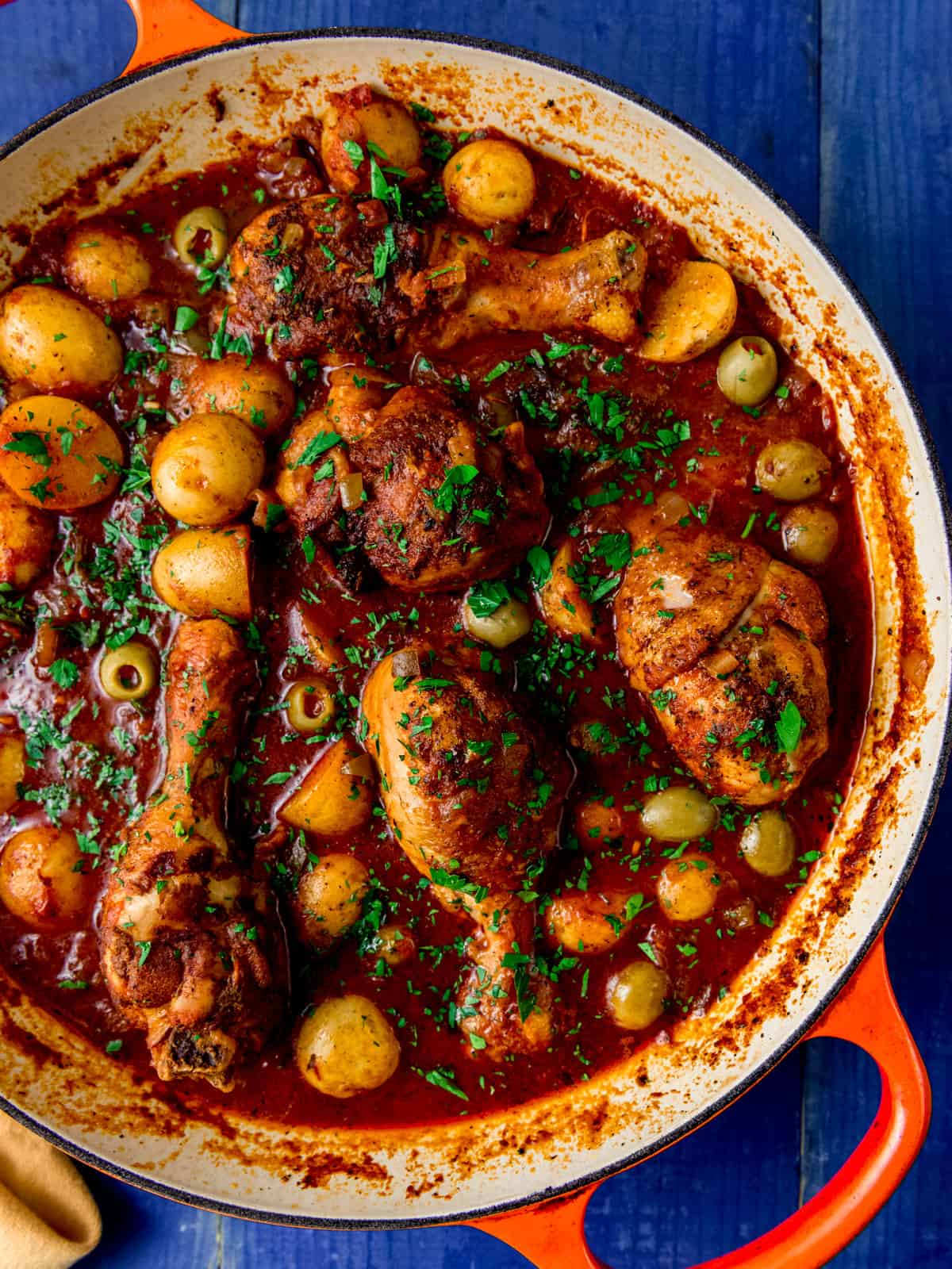 Chicken stew with potatoes and olives in a rich and smoky tomato based stew.
