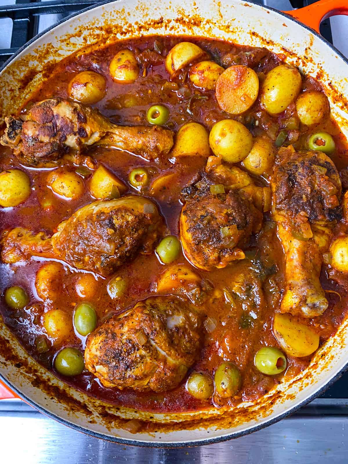 Cook the Spanish chicken stew until the chicken is cooked through and sauce has thickened, about 25 minutes.