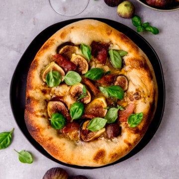 Fig prosciutto pizza with fresh basil.