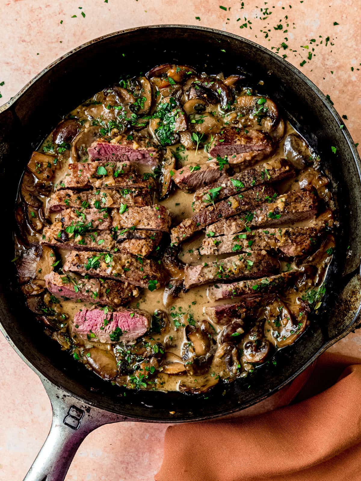 Steak marsala with mushrooms in a creamy marsala wine sauce.