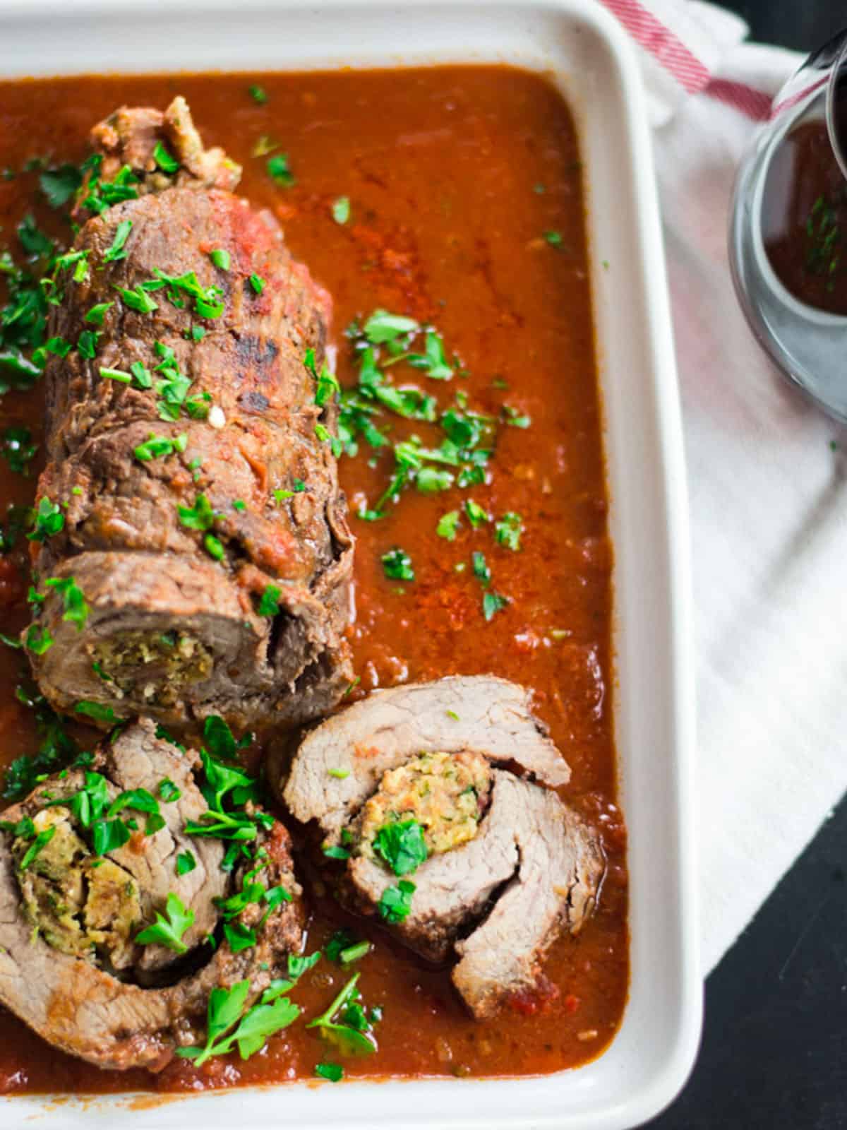 Stuffed beef braciole with prosciutto and parmesan.