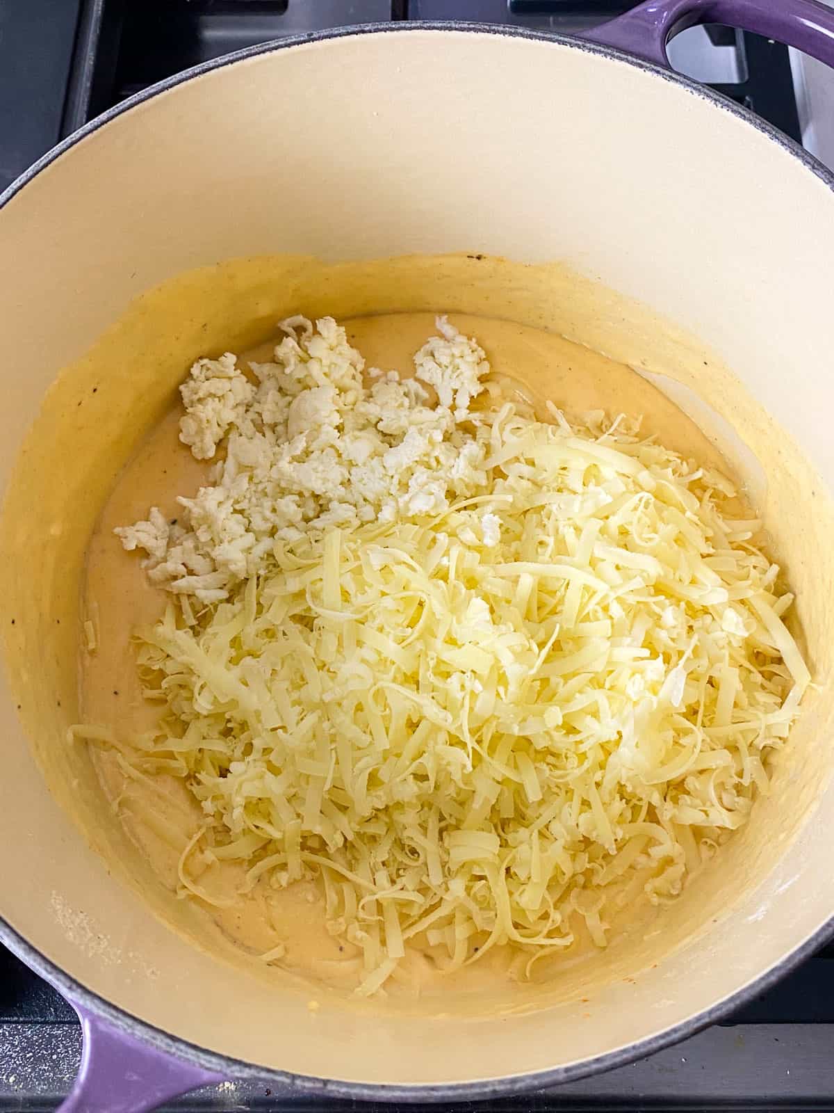 Add all of the cheeses to the bechamel sauce for the mac and cheese.