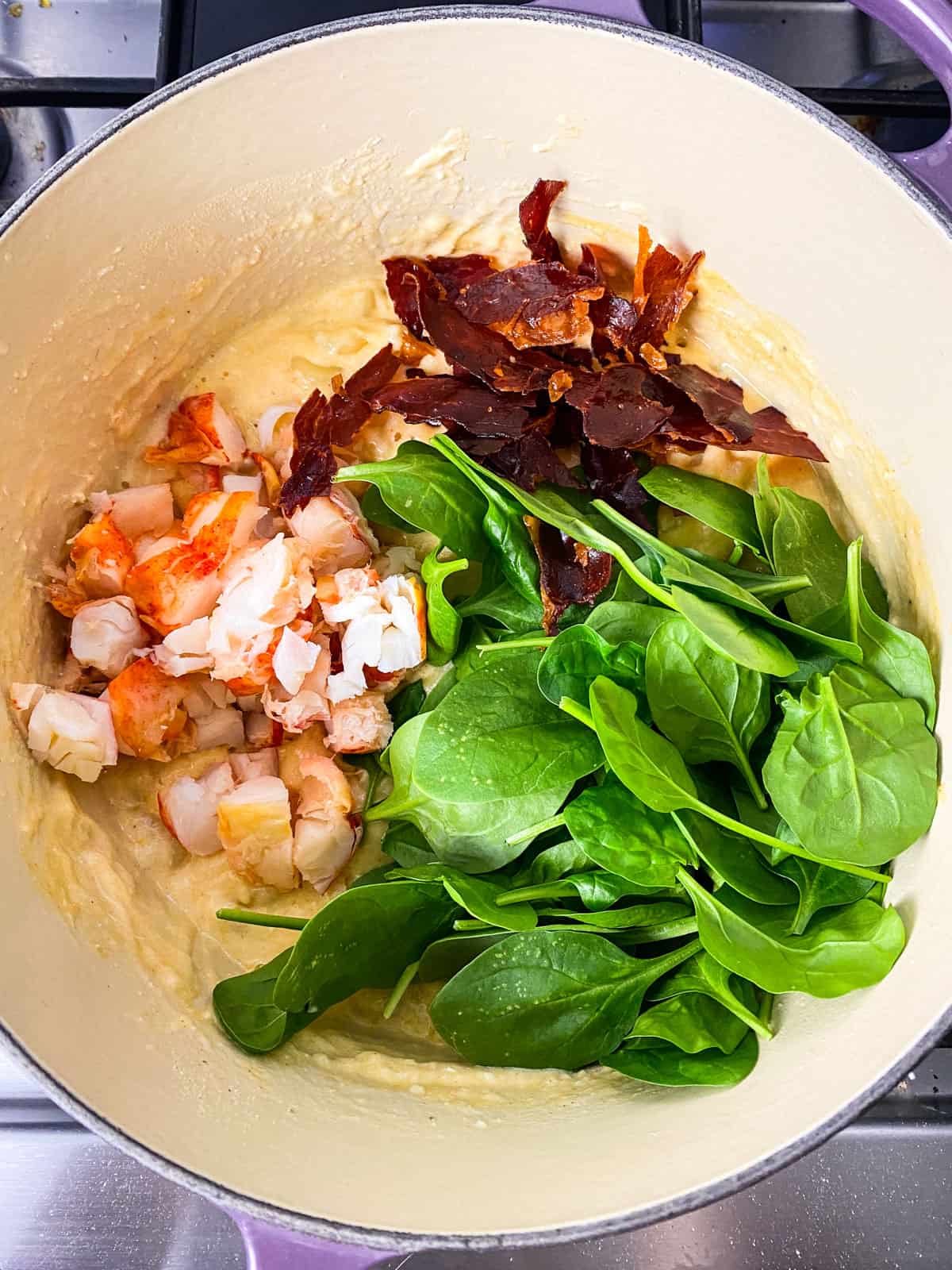 Add the lobster, prosciutto and spinach to the mac and cheese.