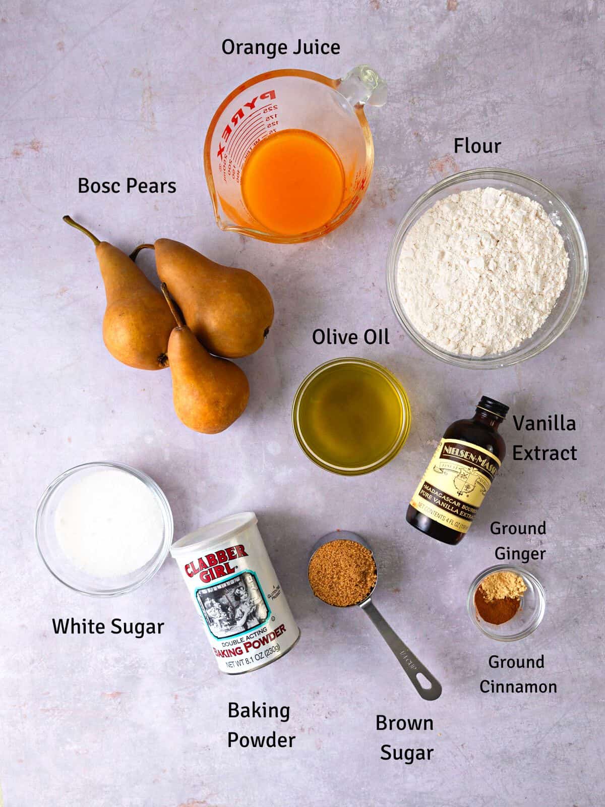 Ingredients for pear ginger cake with olive oil and vanilla extract.