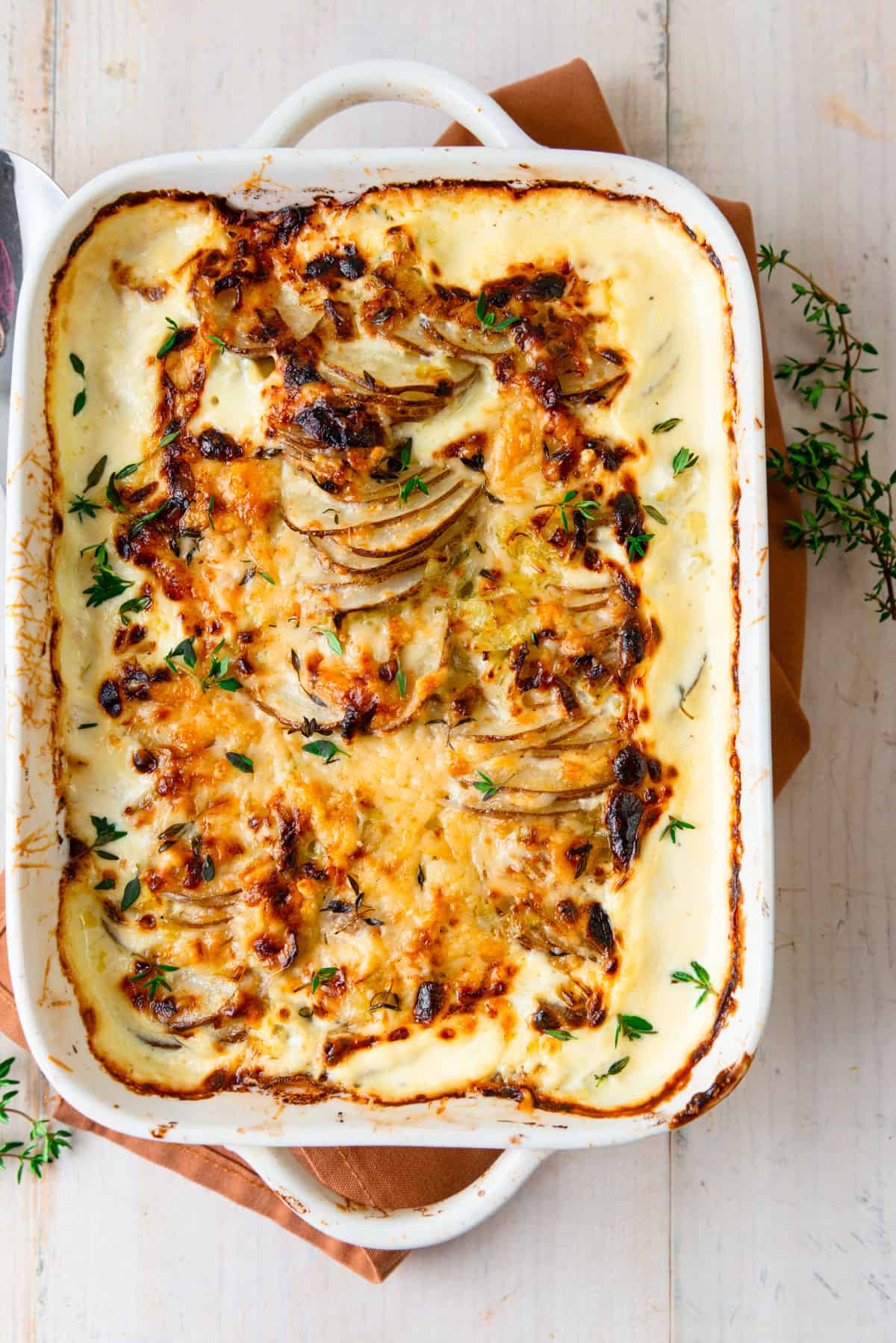 Leek and potato gratin with thyme and Parmesan cheese.