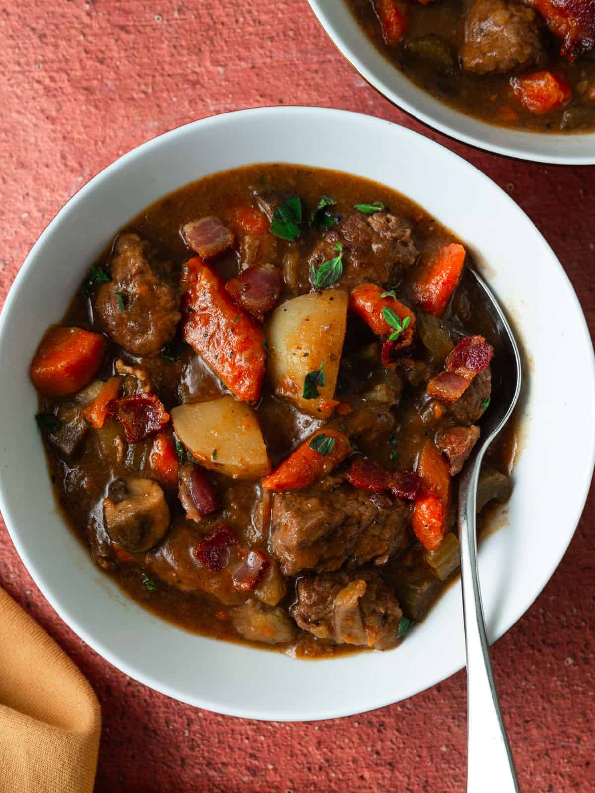Red wine beef stew with bacon and potatoes.