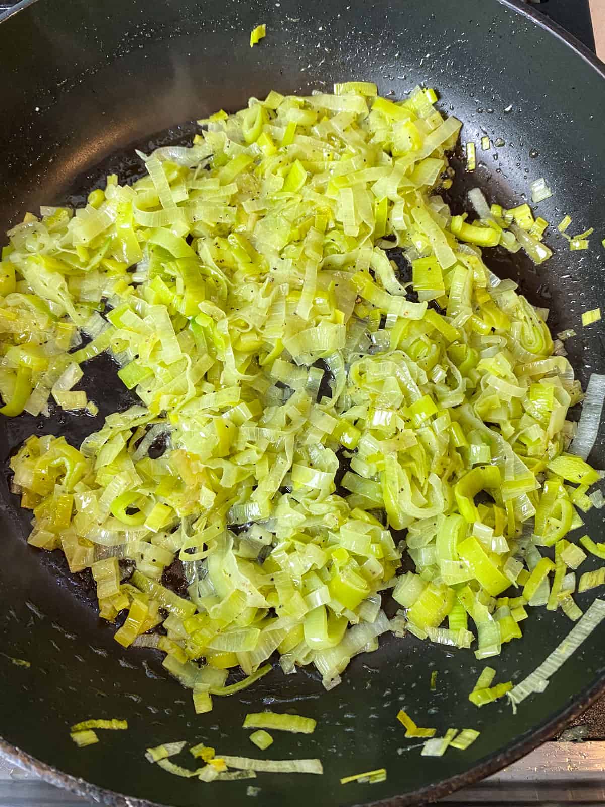 Saute the sliced leeks until softened but not browned.