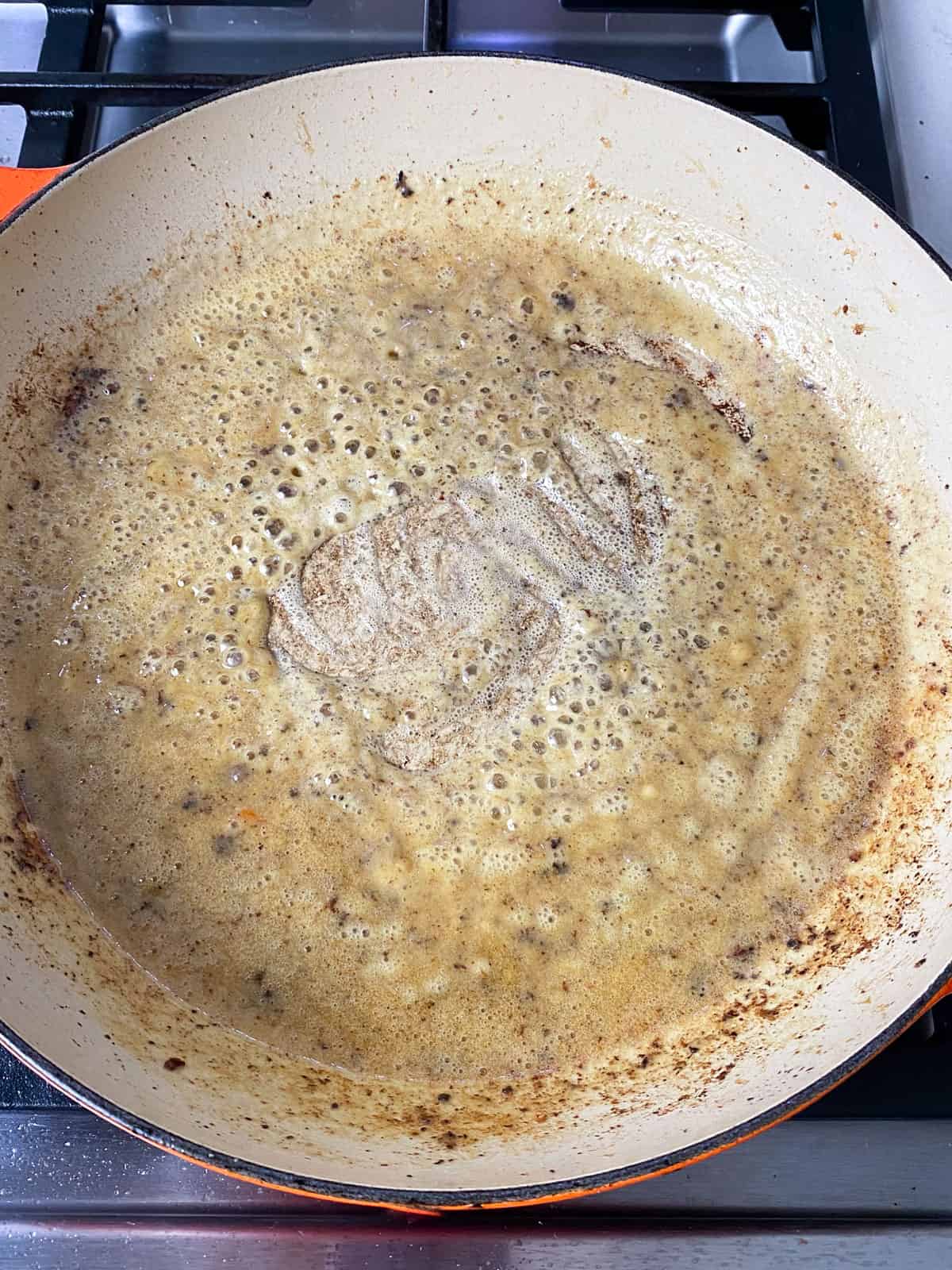 Make the roux by cooking the flour in the remaining pan drippings.