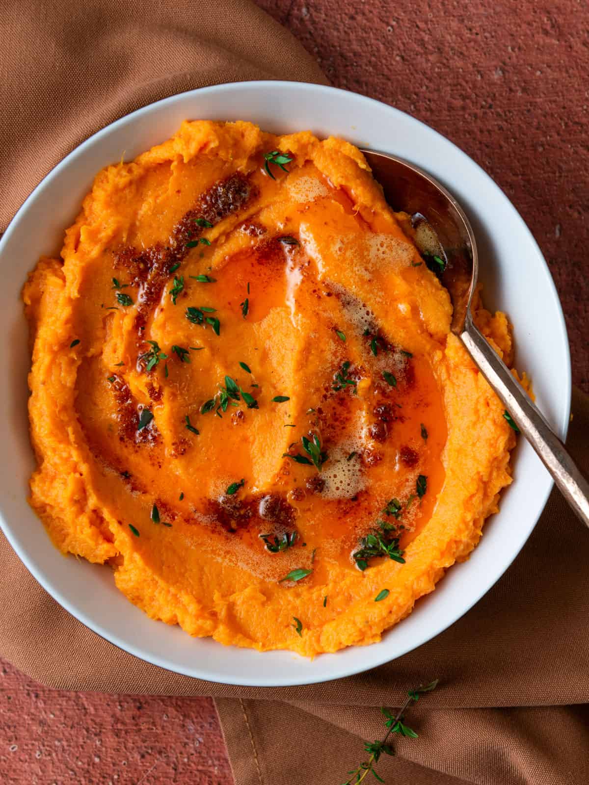 Savory mashed sweet potatoes with smoked butter and thyme.