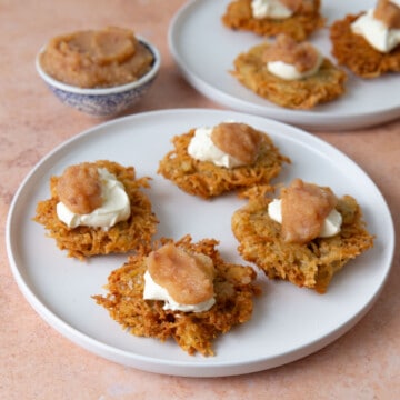 Potato and celery root latkes topped with applesauce and sour cream.