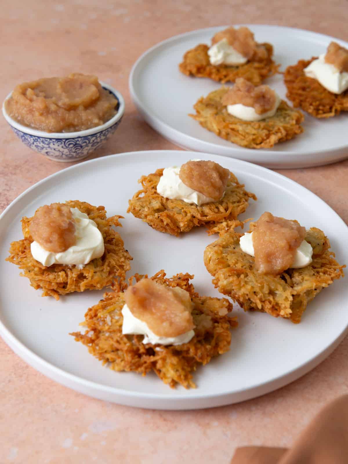 Celery root and potato latkes topped with applesauce and sour cream.