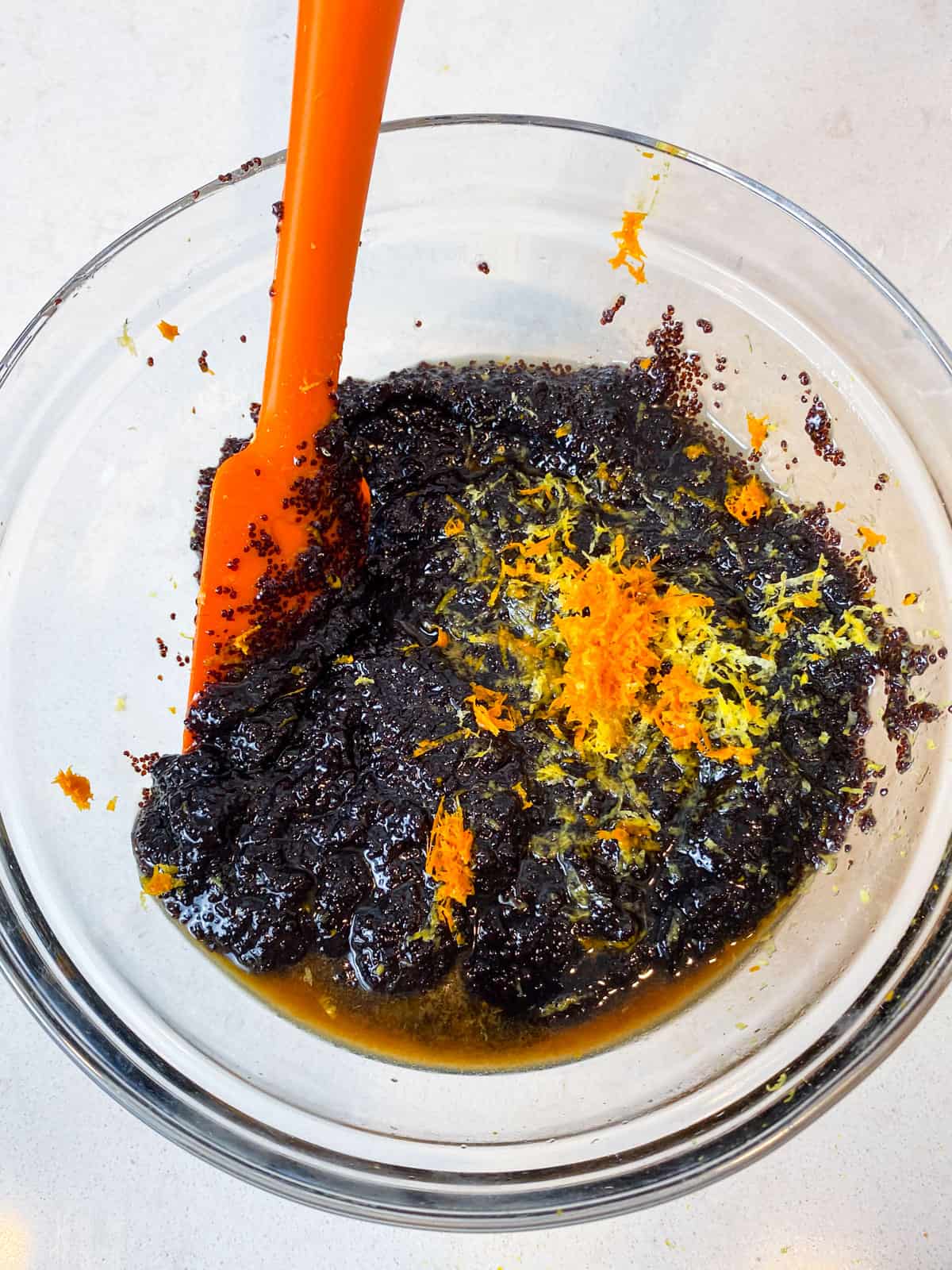 Add the vanilla extract and citrus zest to the sweetened poppyseed mixture.