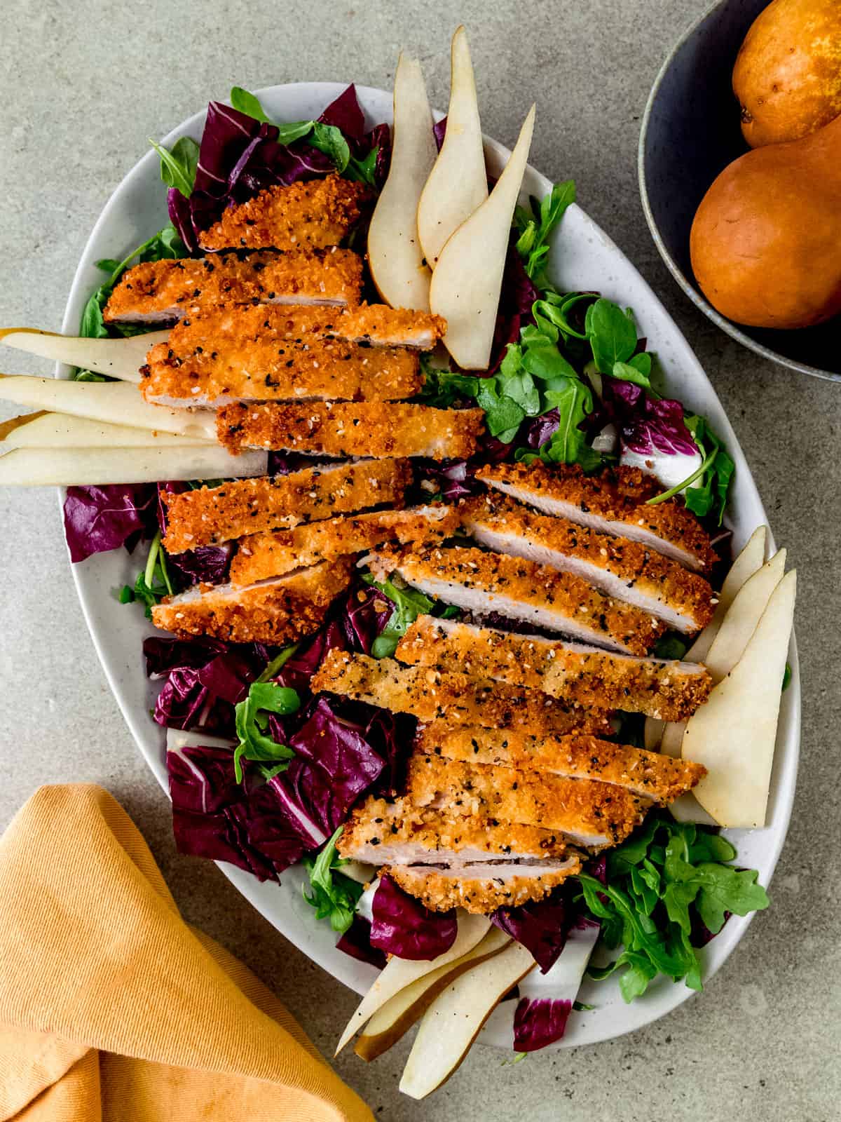 Everything spiced chicken cutlets with radicchio and pear salad.
