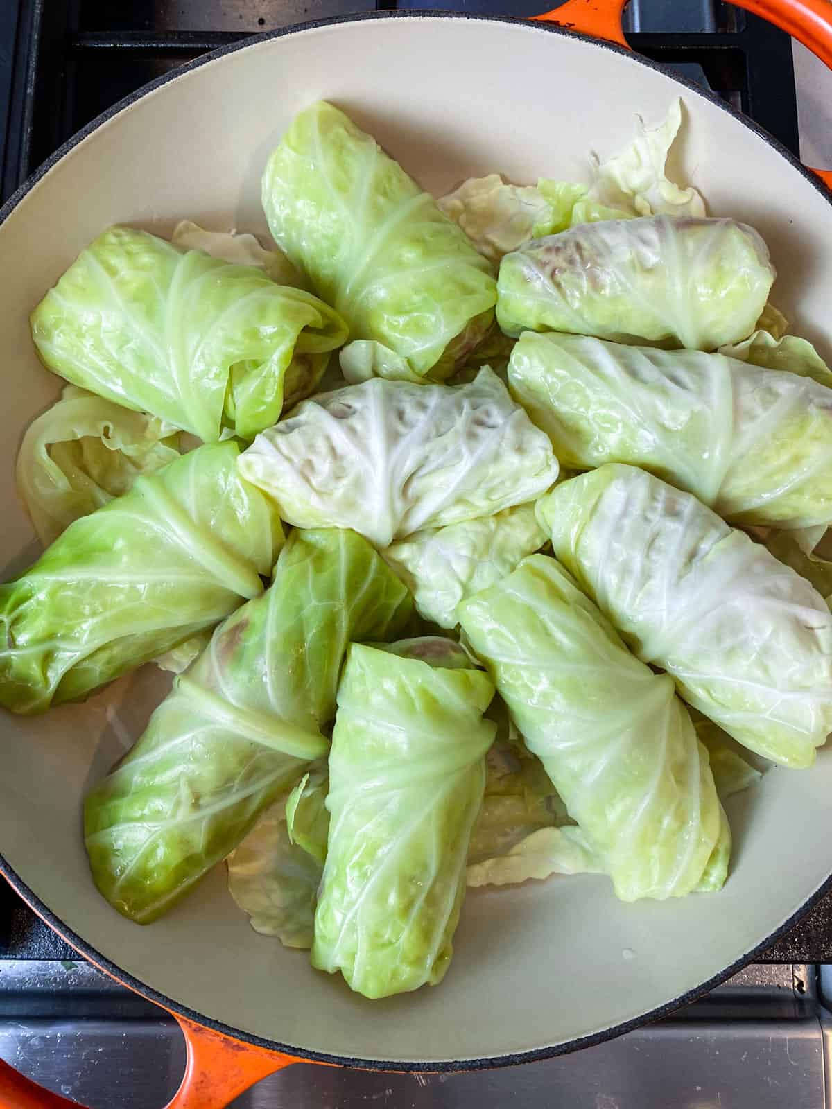 Nestle the stuffed cabbage rolls into a pot.