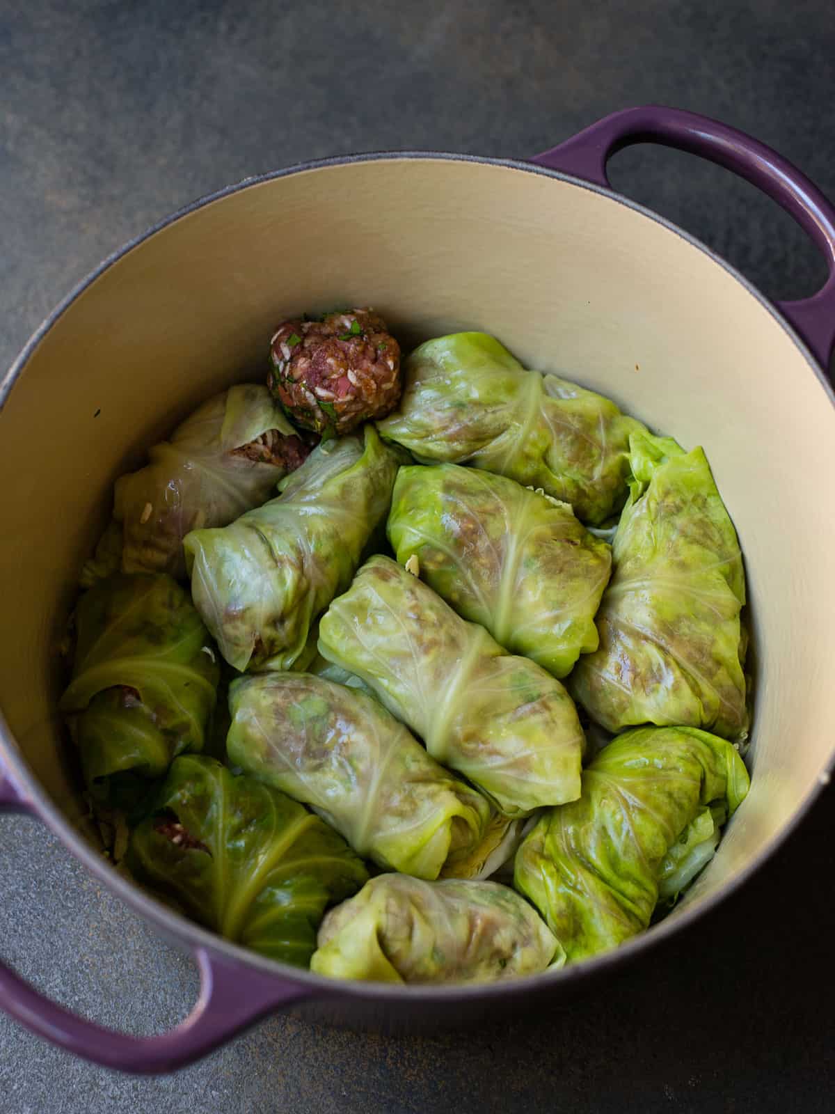 Rolled beef cabbage rolls in a pot.