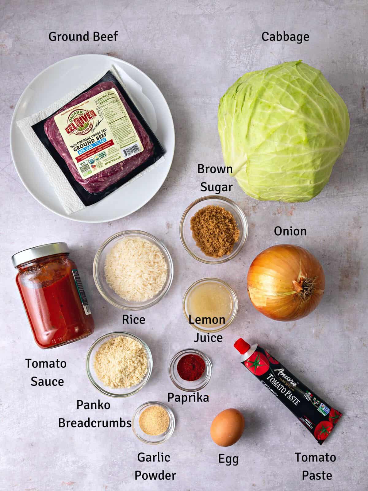 Ingredients for sweet and sour cabbage rolls, including rice, ground beef and brown sugar.