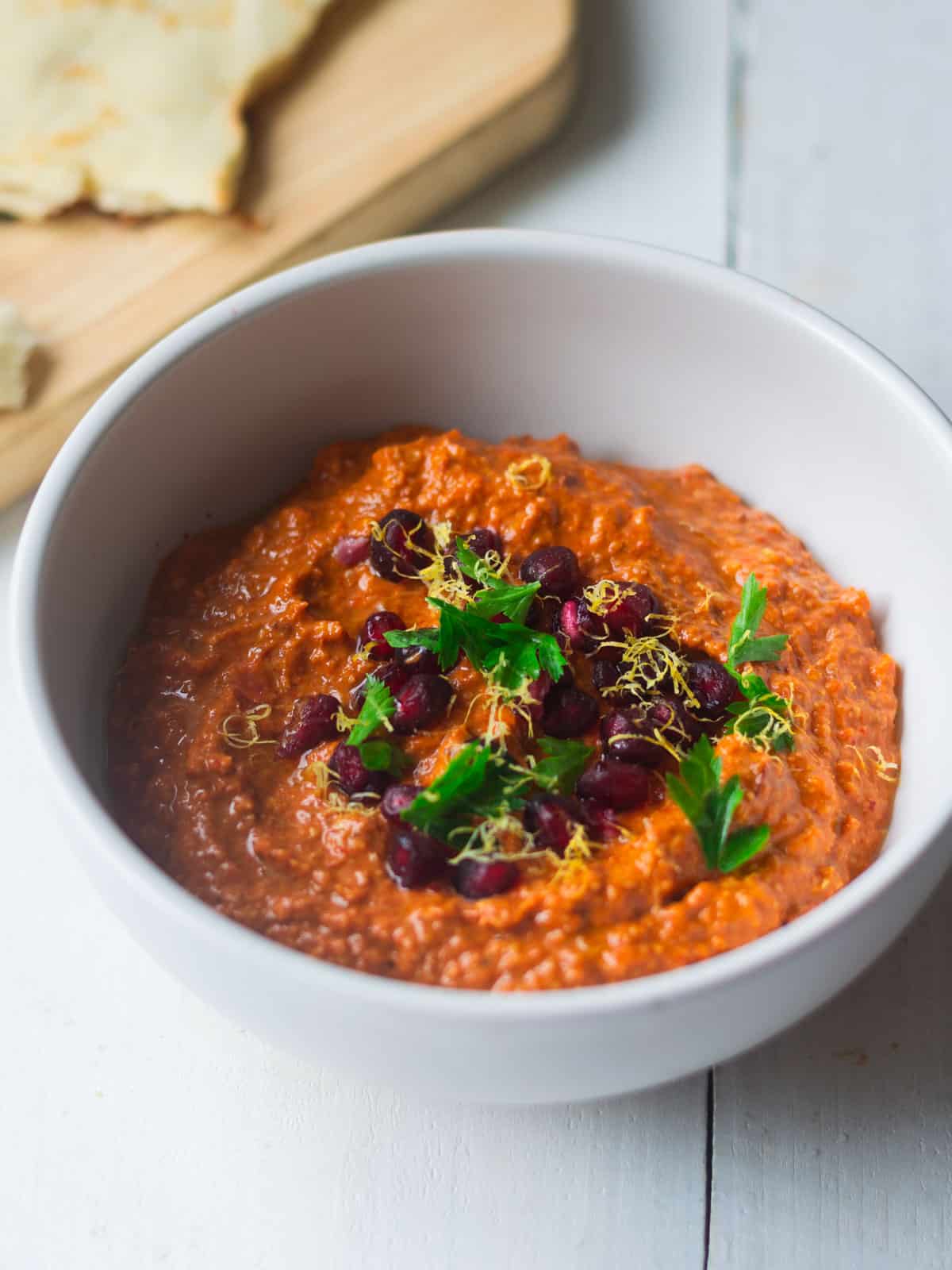 Turkish red pepper and walnut dip with pomegranate molasses, warm spices and garnished with lemon zest.