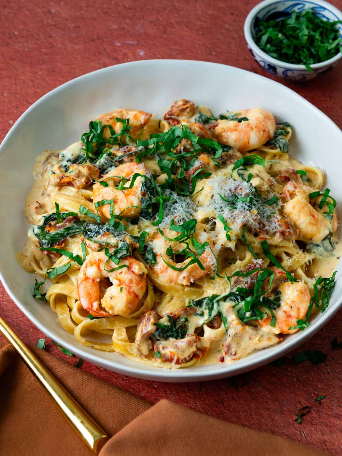 Creamy shrimp pasta with sundried tomatoes, spinach and Parmesan.