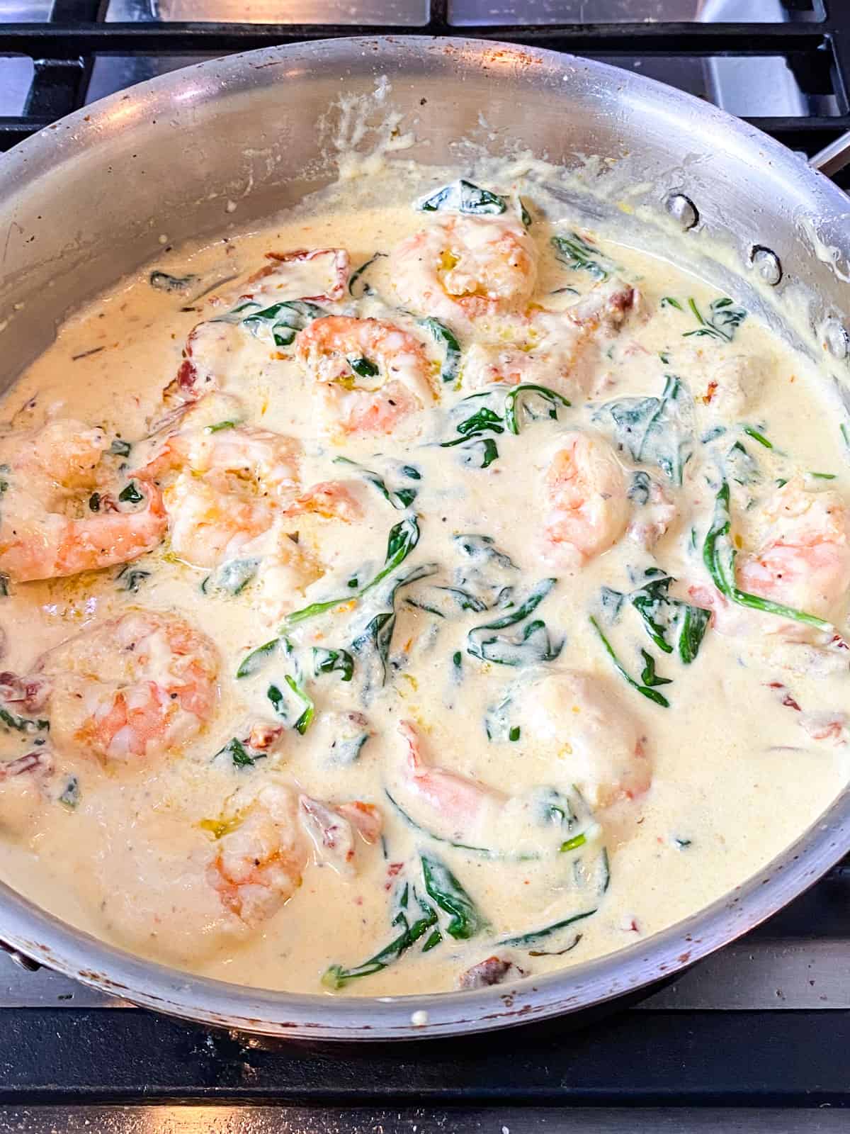 Add the seared shrimp to the cream sauce right towards the end.