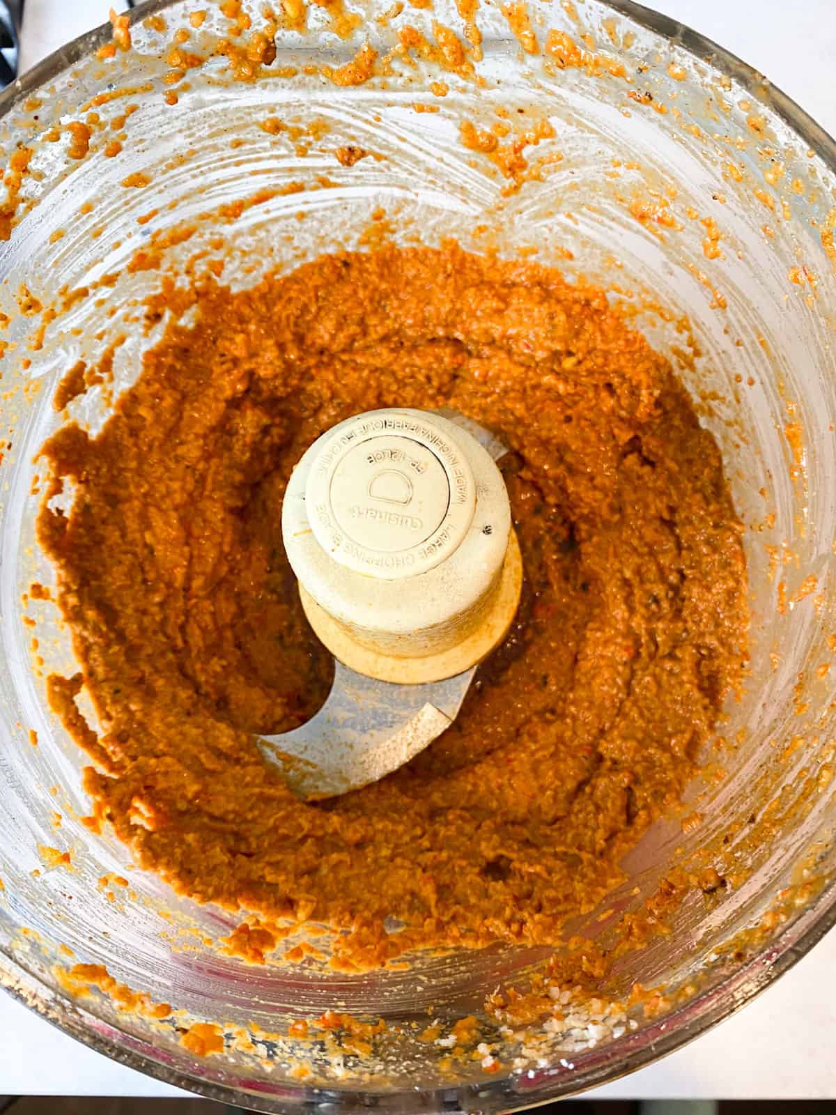 Blend the muhammara in a food processor until there are no large pieces left and the mixture is smooth.