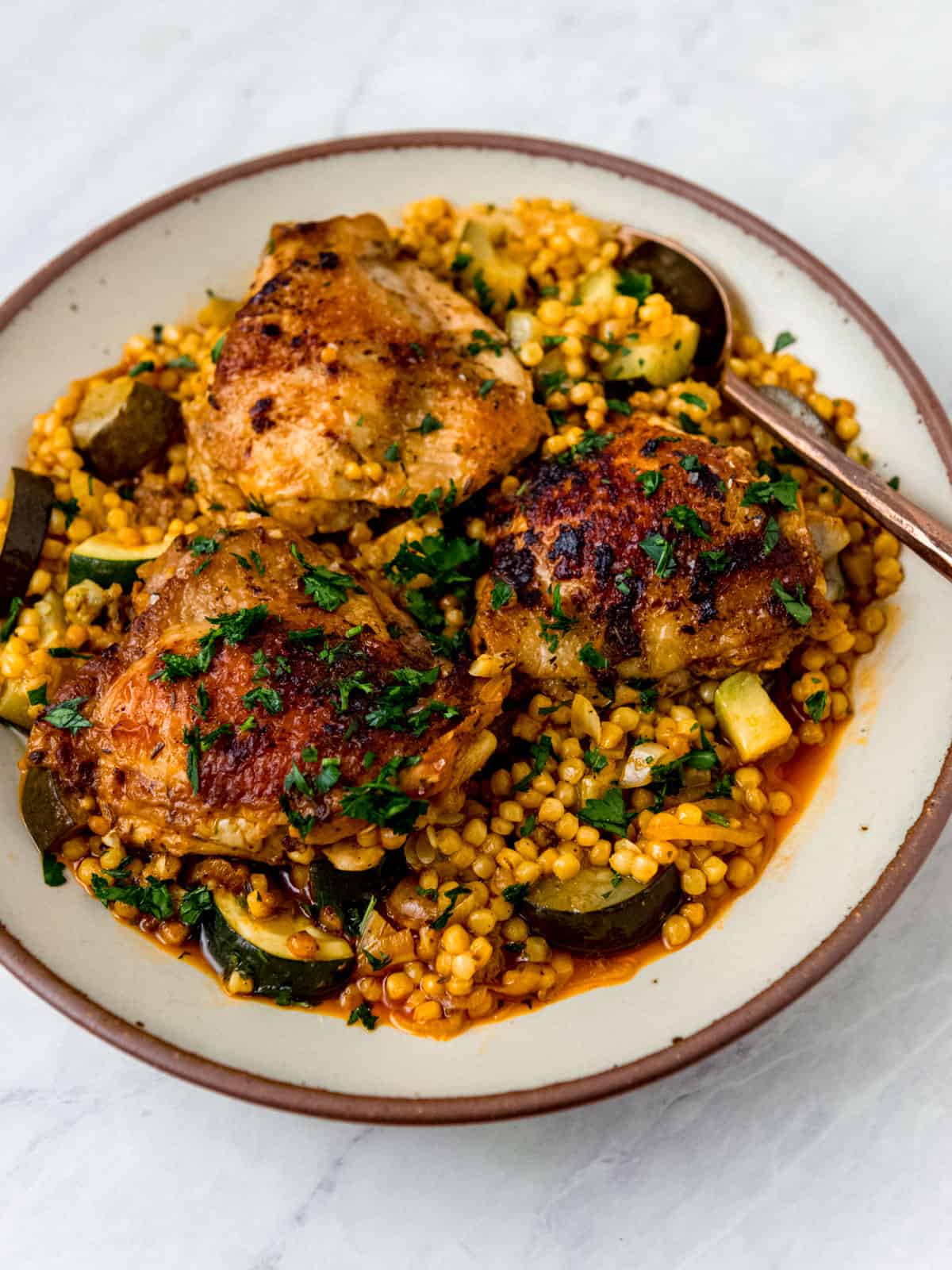 One pot chicken with pearl couscous and zucchini.