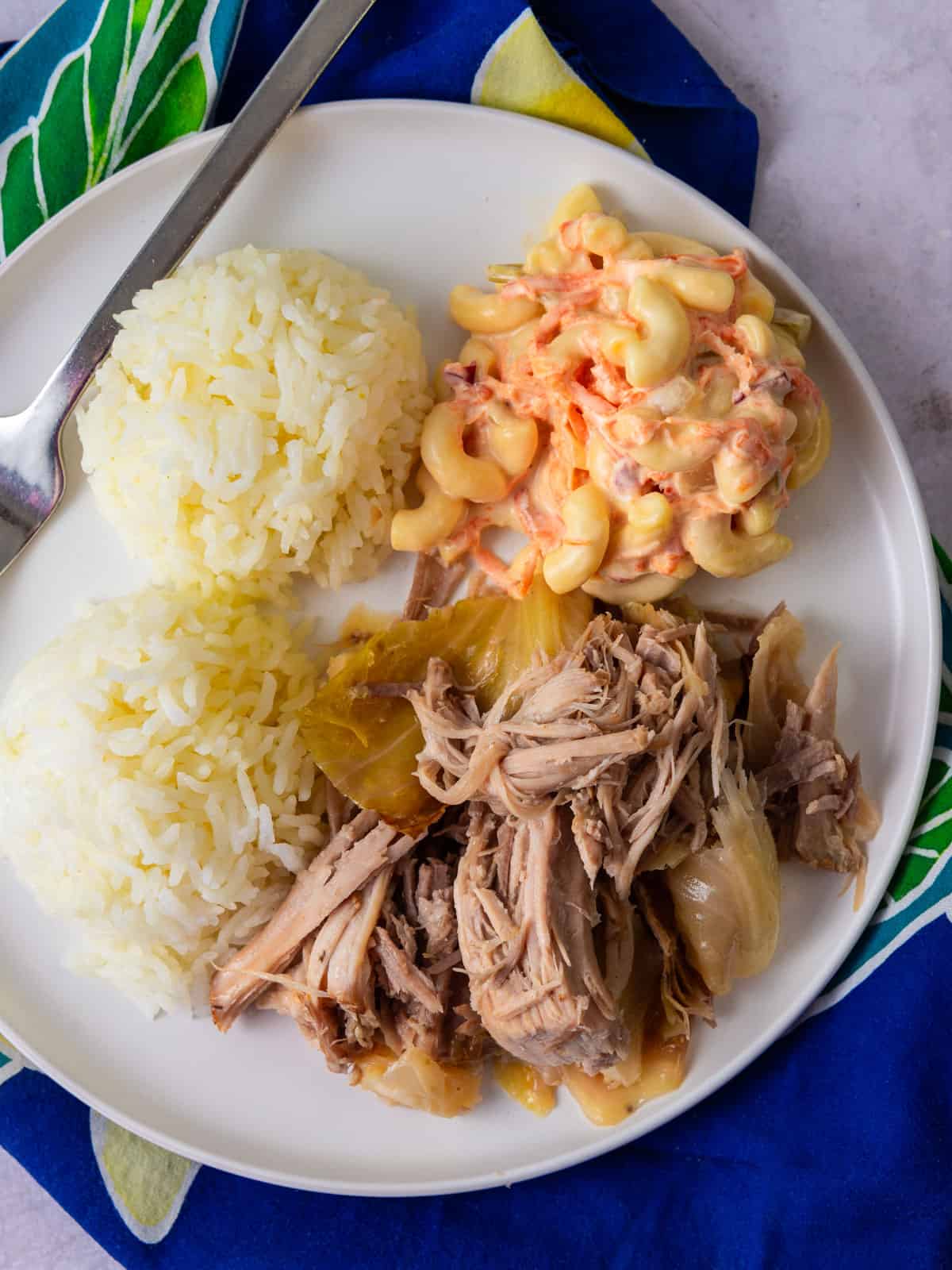 Kalua pork and cabbage plate lunch with mac salad and white rice.