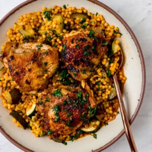 One pot chicken with saffron pearl couscous and zucchini.